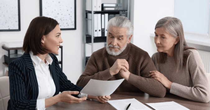 An older couple meets with an attorney