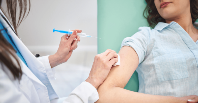 Woman getting her Depo shot birth control injection